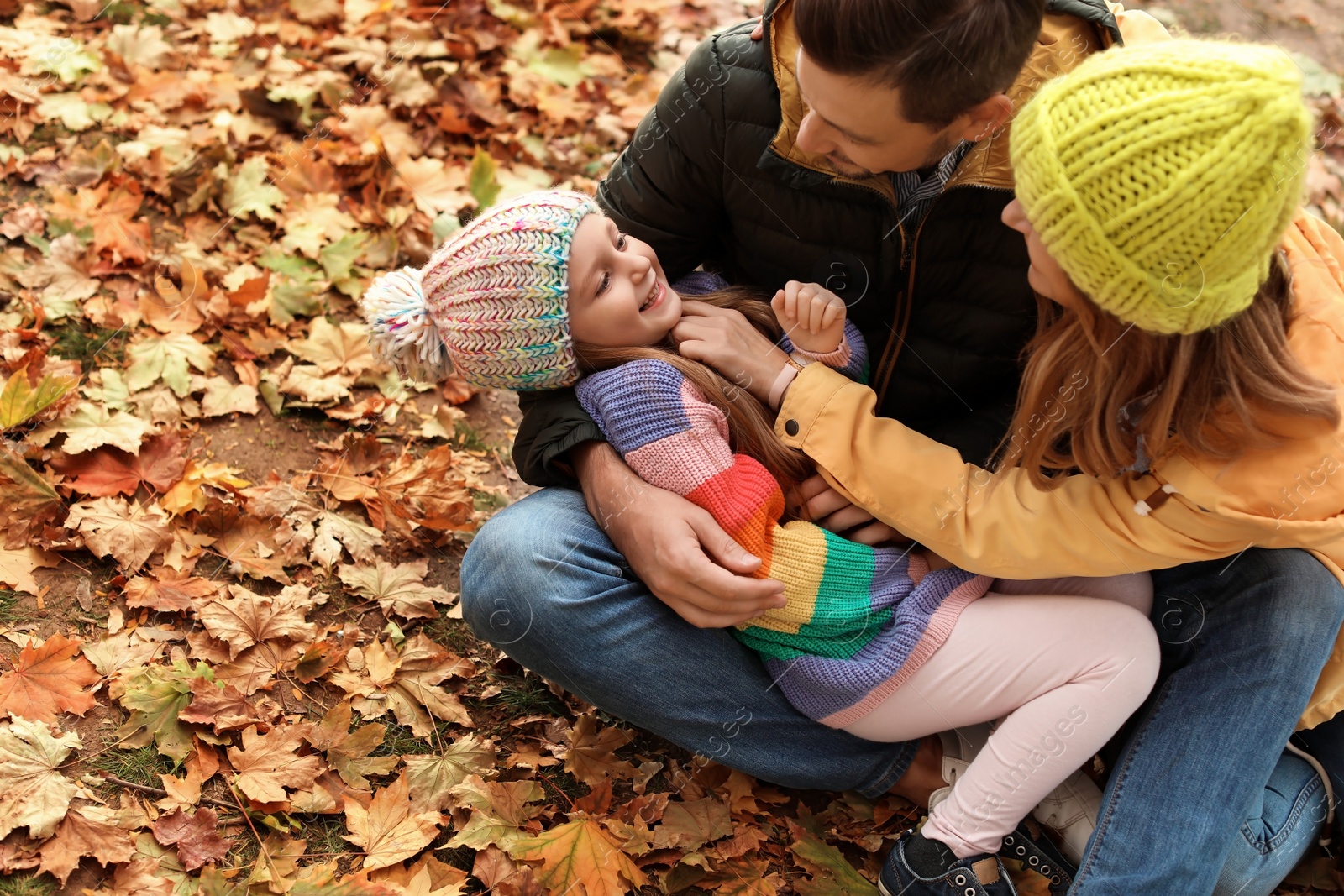 Photo of Happy family with child together in park. Autumn walk