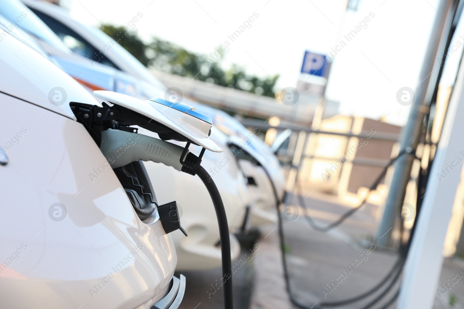 Photo of Charging modern electric cars from station outdoors