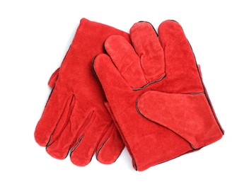 Photo of Red protective gloves on white background, top view. Safety equipment