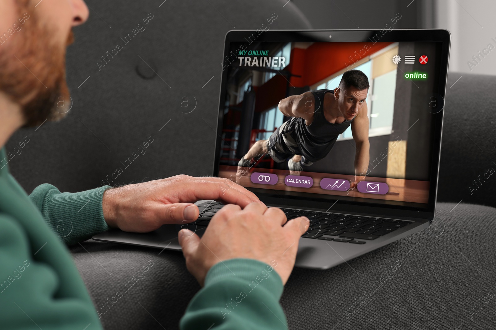 Image of Personal trainer online. Man viewing website via laptop at home, closeup