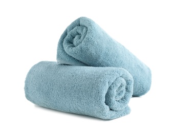 Photo of Rolled soft terry towels on white background