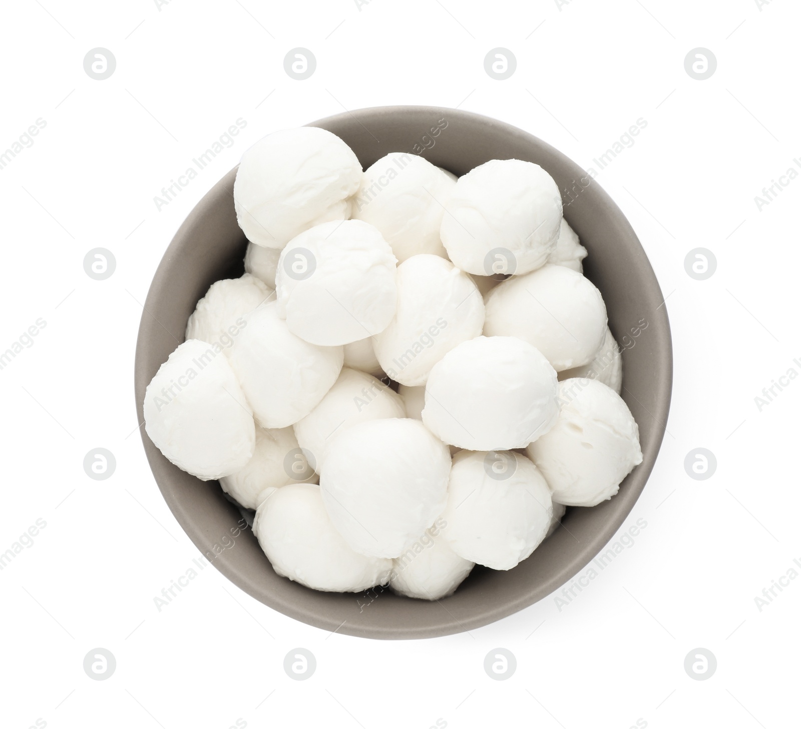 Photo of Bowl with mozzarella cheese balls on white background, top view