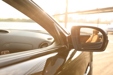 Photo of Black luxury convertible car outdoors, closeup view