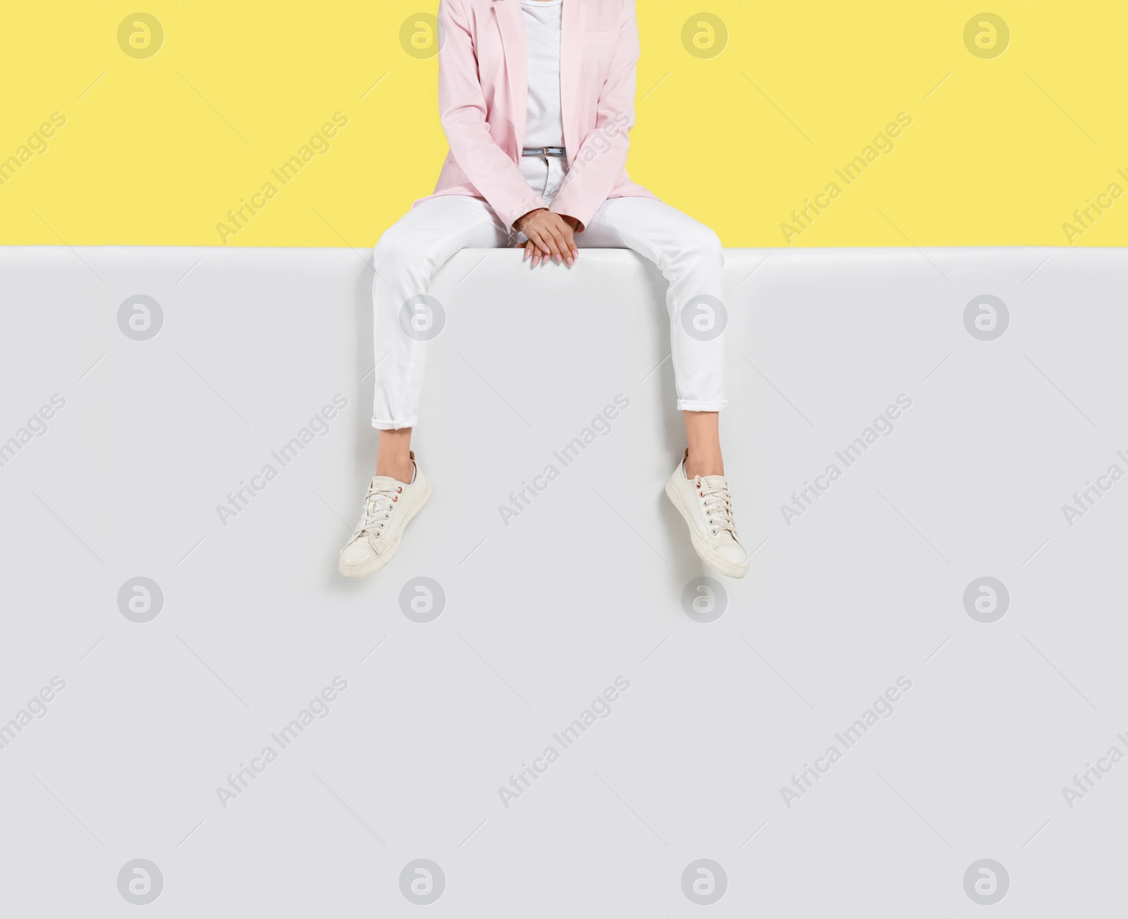 Photo of Woman wearing stylish shoes on color background, closeup