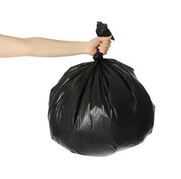 Photo of Woman holding trash bag full of garbage on white background, closeup
