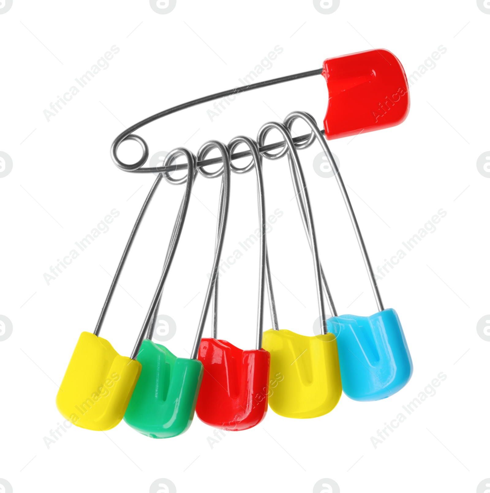 Photo of New colorful safety pins on white background