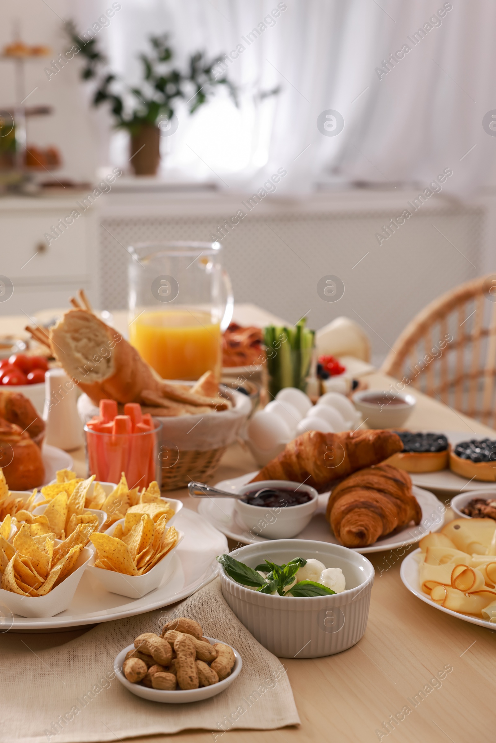 Photo of Dishes with different food on table in room. Luxury brunch