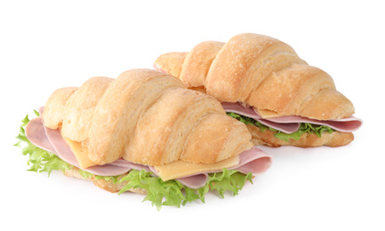 Photo of Tasty croissant sandwiches with ham isolated on white