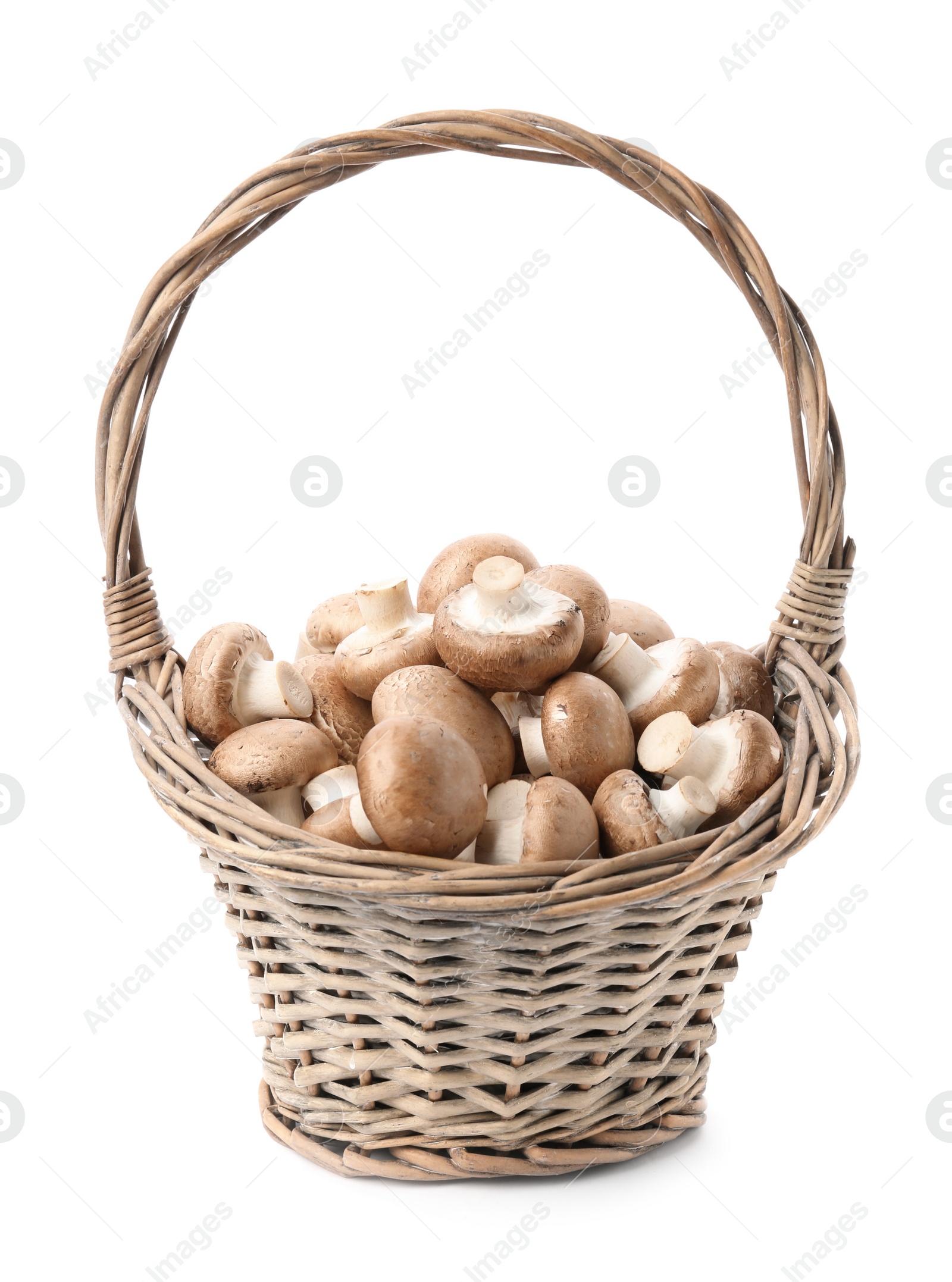 Photo of Wicker basket with fresh raw champignon mushrooms on white background