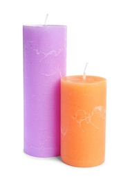 Two decorative wax candles on white background