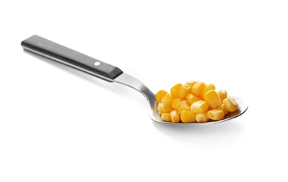 Photo of Spoon with corn kernels on white background