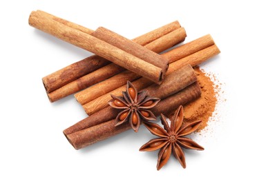 Photo of Dry aromatic cinnamon sticks, powder and anise stars isolated on white, top view