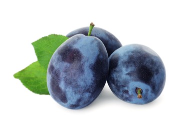 Delicious fresh ripe plums on white background