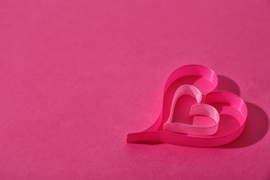 Photo of Hearts made of ribbons and space for text on color background
