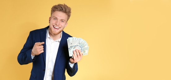 Image of Businessman with money on orange background, space for text. Banner design