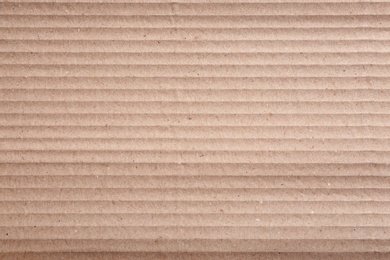 Photo of Sheet of cardboard as background, top view. Recycling concept
