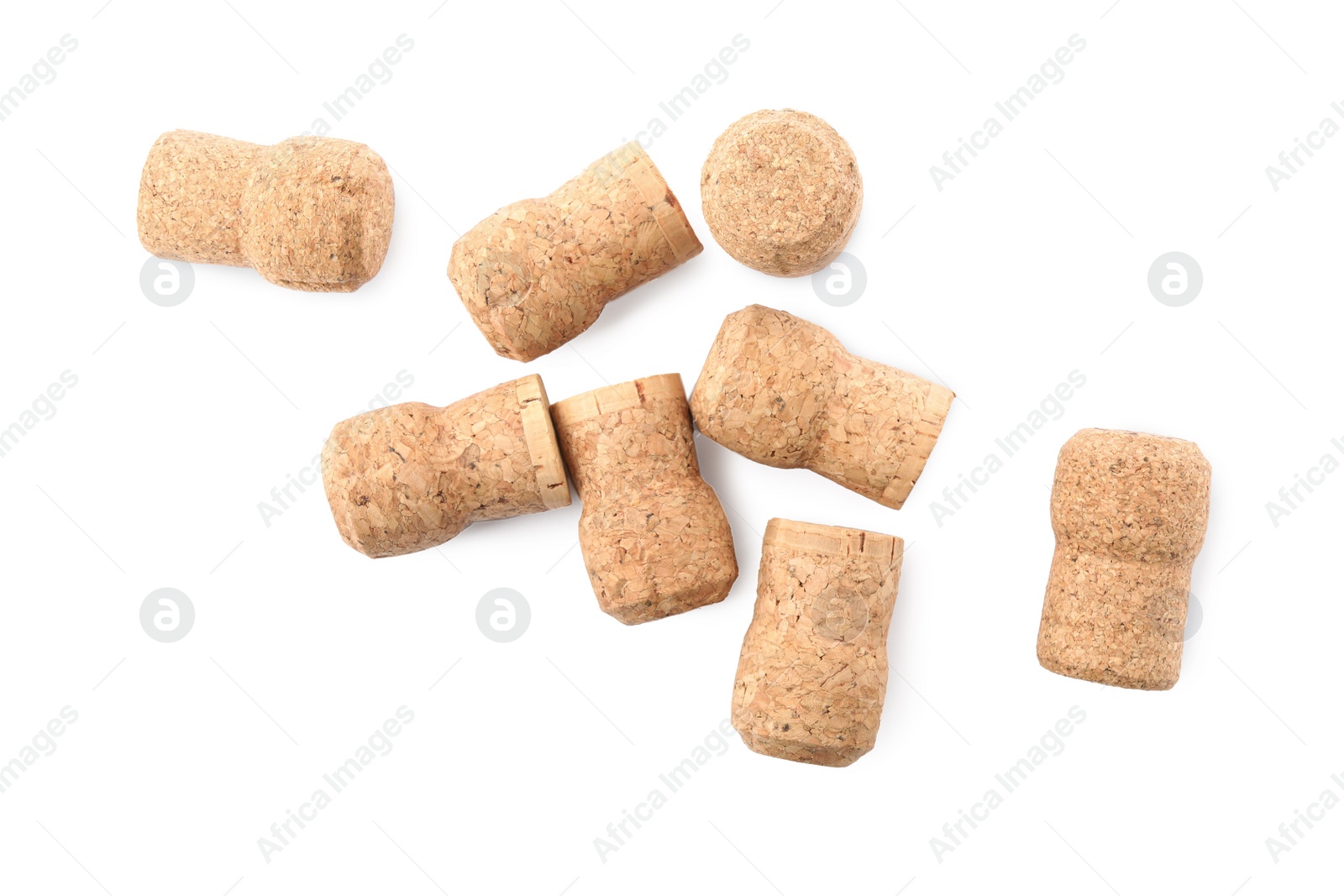 Photo of Many sparkling wine corks on white background, top view