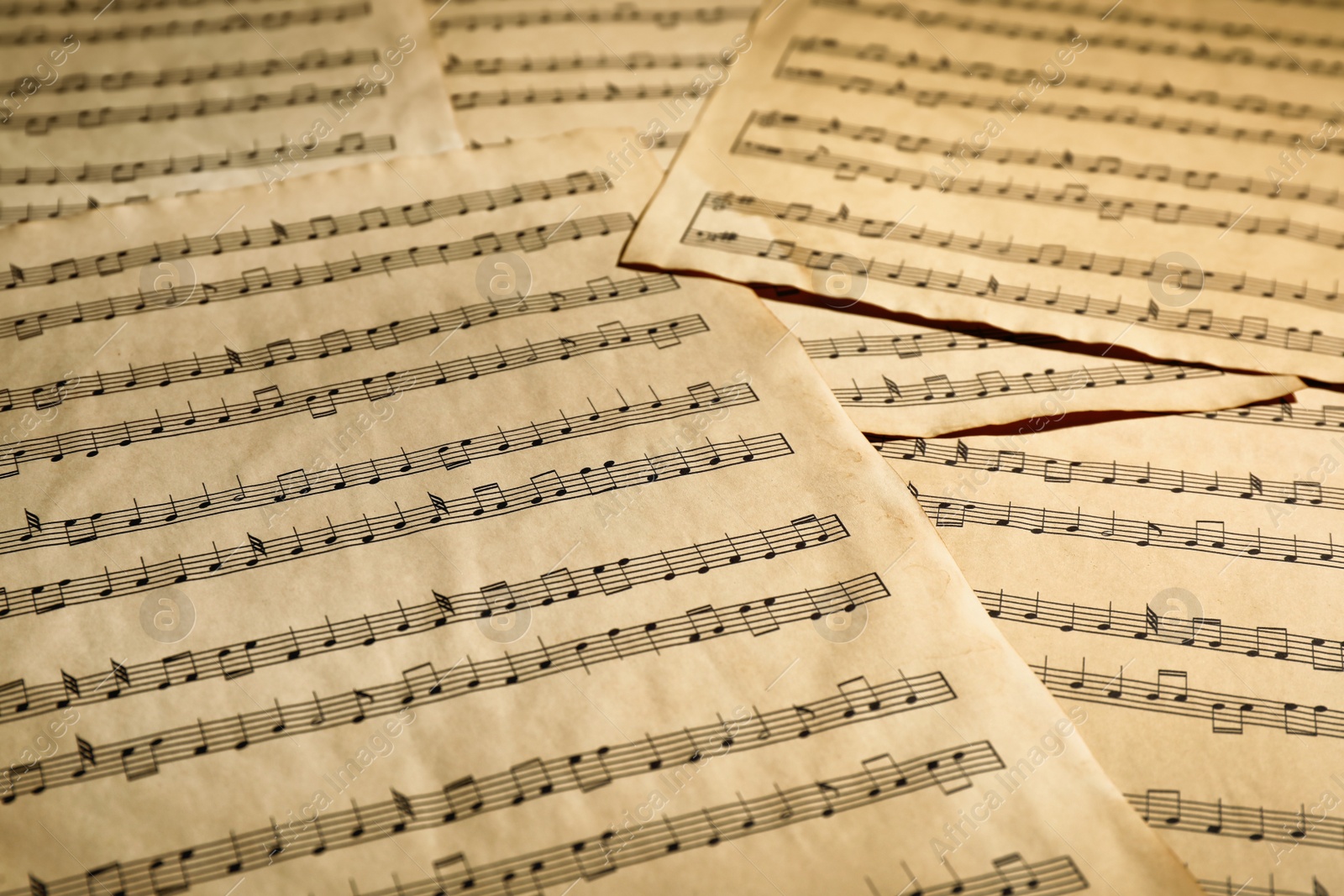 Photo of Many old note sheets as background, closeup