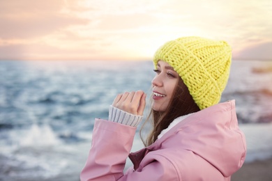 Photo of Portrait of beautiful young woman near sea