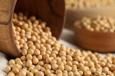 Natural soy beans on wooden table, closeup