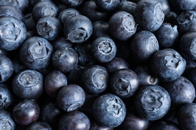 Photo of Fresh raw blueberries as background, top view