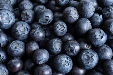 Fresh raw blueberries as background, top view