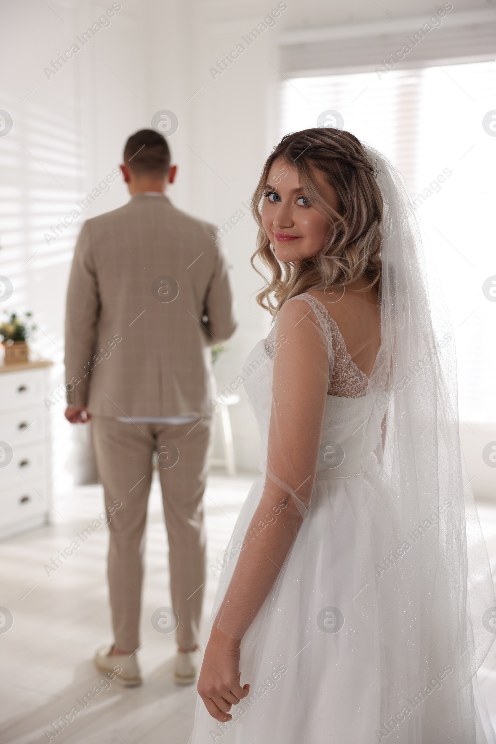 Photo of Groom waiting for his lovely bride. First meeting at wedding day