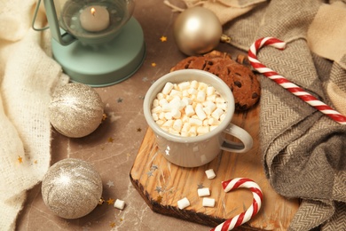 Photo of Composition with cup of hot winter drink on table. Cozy season