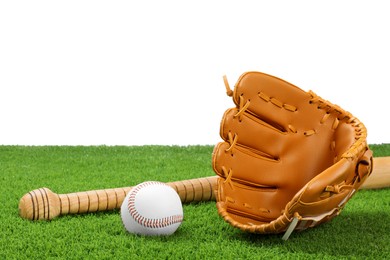 Photo of Baseball bat, ball and catcher's mitt on artificial grass against white background