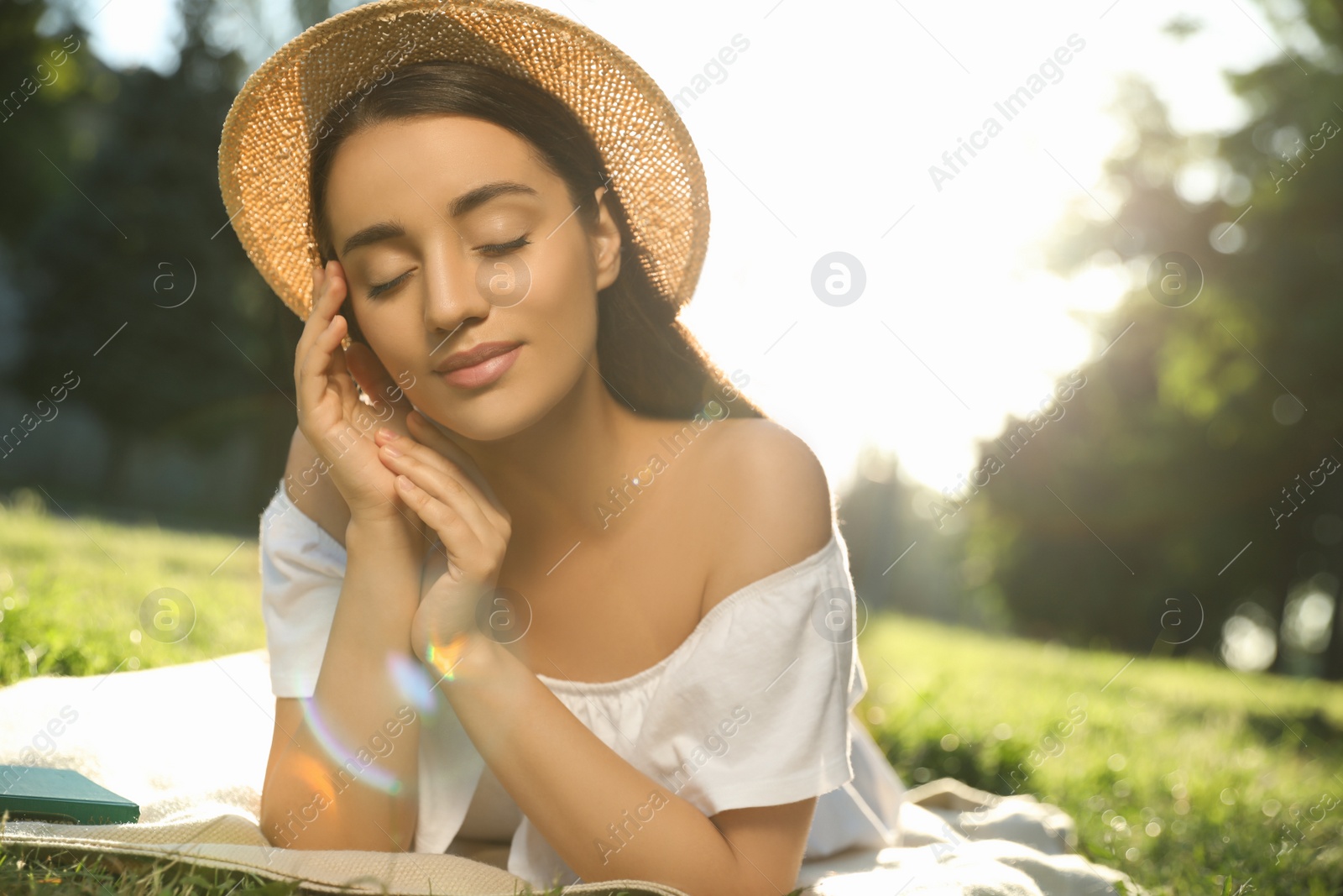 Photo of Beautiful young woman in park on sunny day