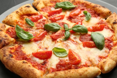 Photo of Delicious Margherita pizza on table, closeup view