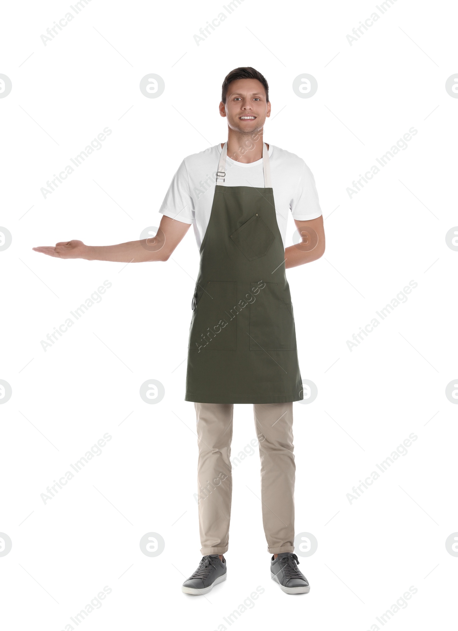 Photo of Full length portrait of happy young waiter in uniform on white background