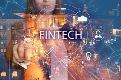 Image of Fintech concept. Double exposure of cityscape and businesswoman, closeup