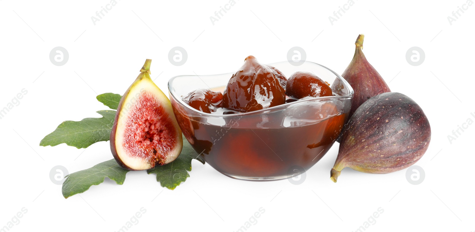 Photo of Bowl of tasty sweet jam, fresh figs and green leaf isolated on white
