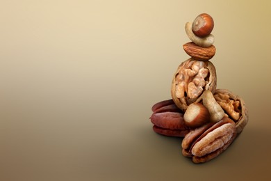 Image of Many different nuts on light brown gradient background, space for text