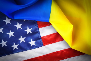 Image of National flags of Ukraine and USA symbolizing partnership between countries