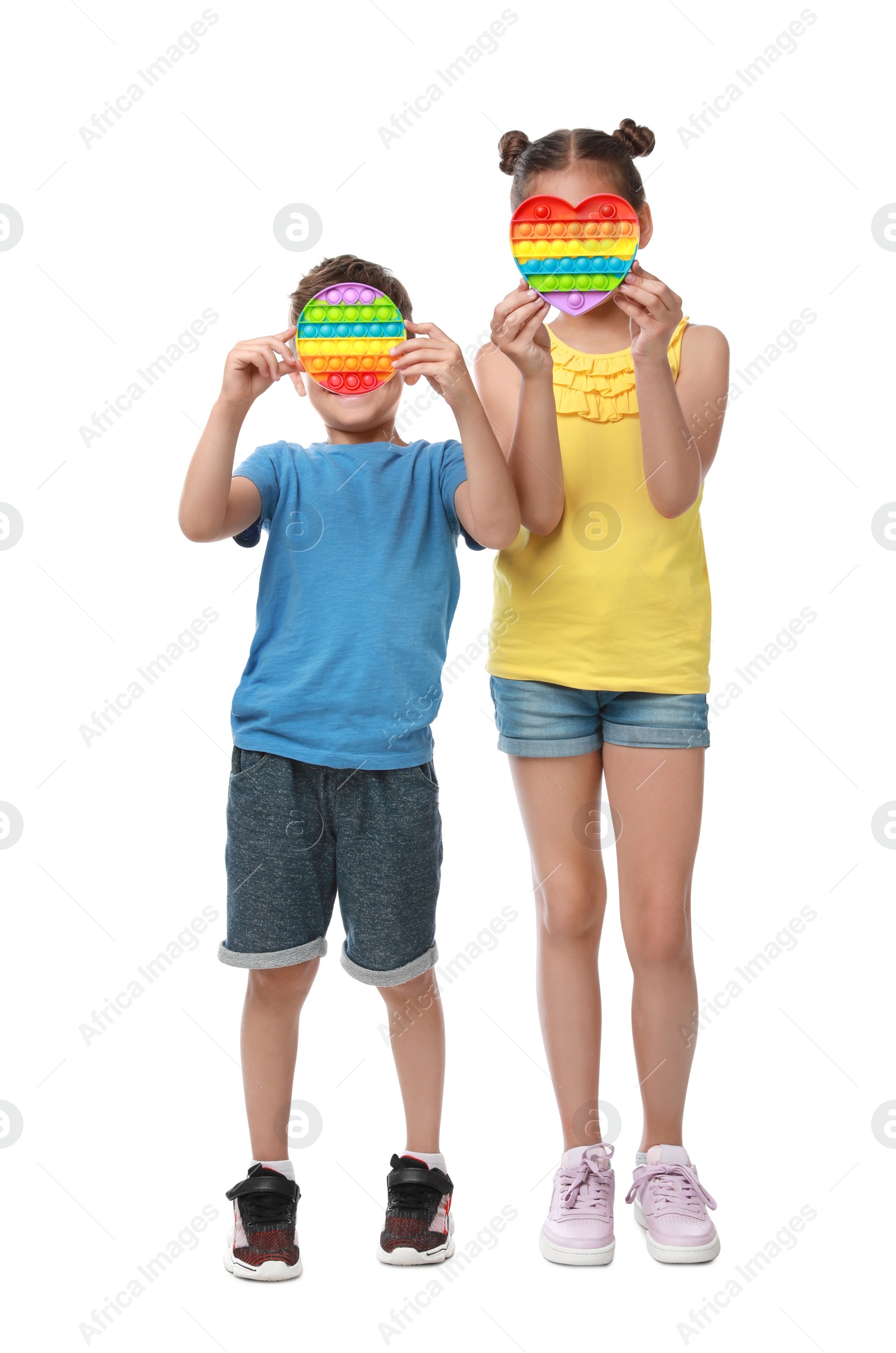 Photo of Children with pop it fidget toys on white background