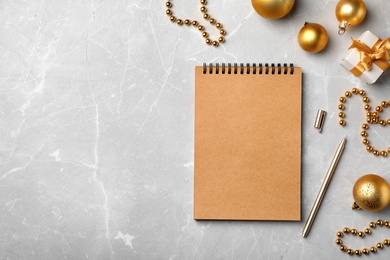 Photo of Notebook and decor on table, top view. Christmas countdown