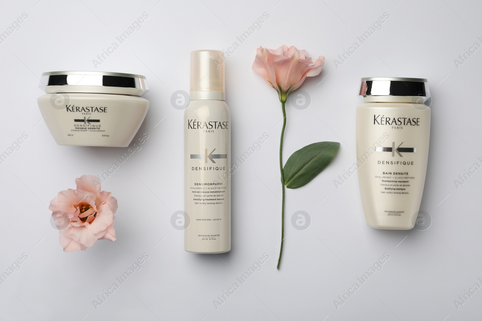 Photo of MYKOLAIV, UKRAINE - SEPTEMBER 07, 2021: Flat lay composition with Kerastase hair care cosmetic products on light grey background