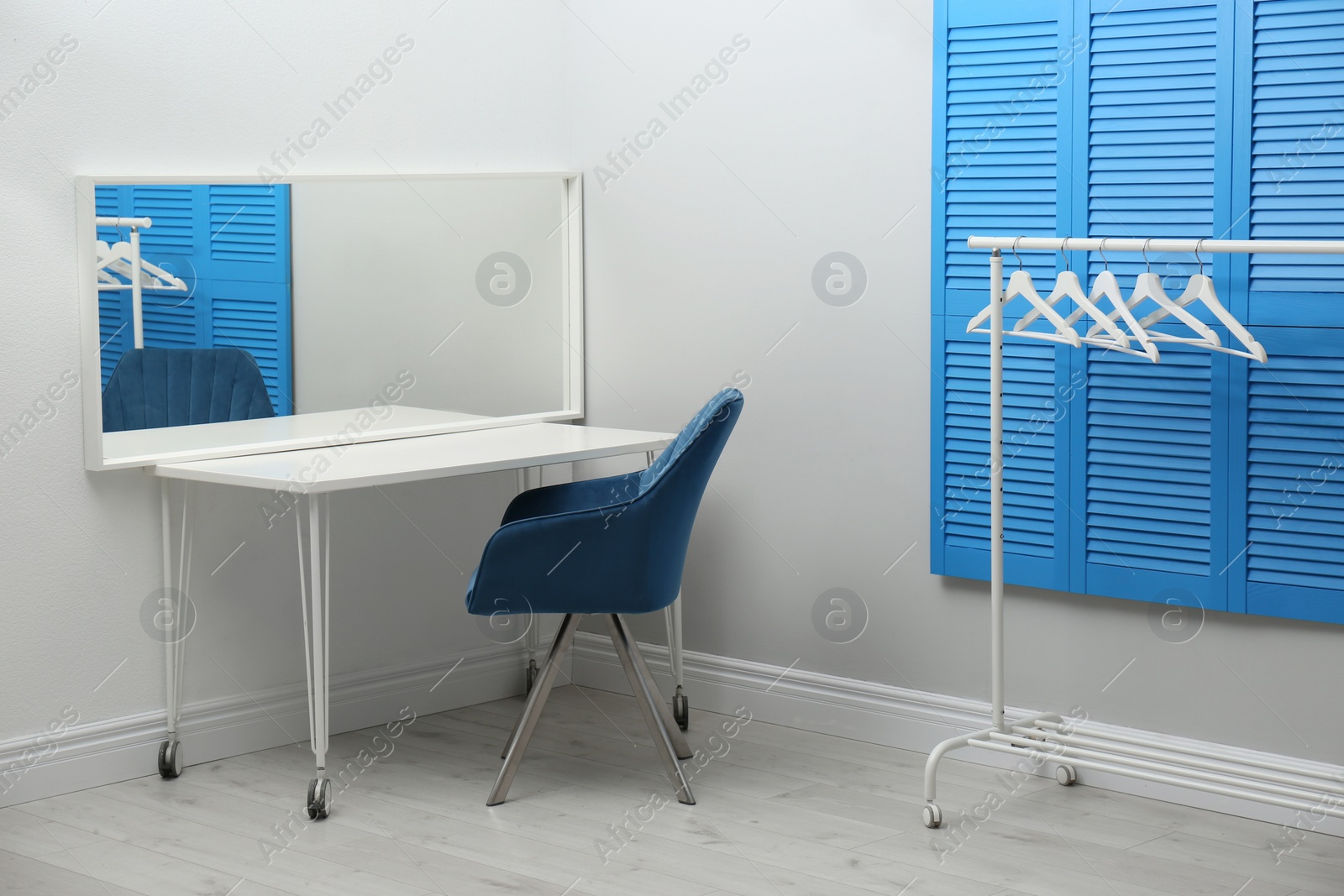 Photo of Elegant dressing room interior with makeup table