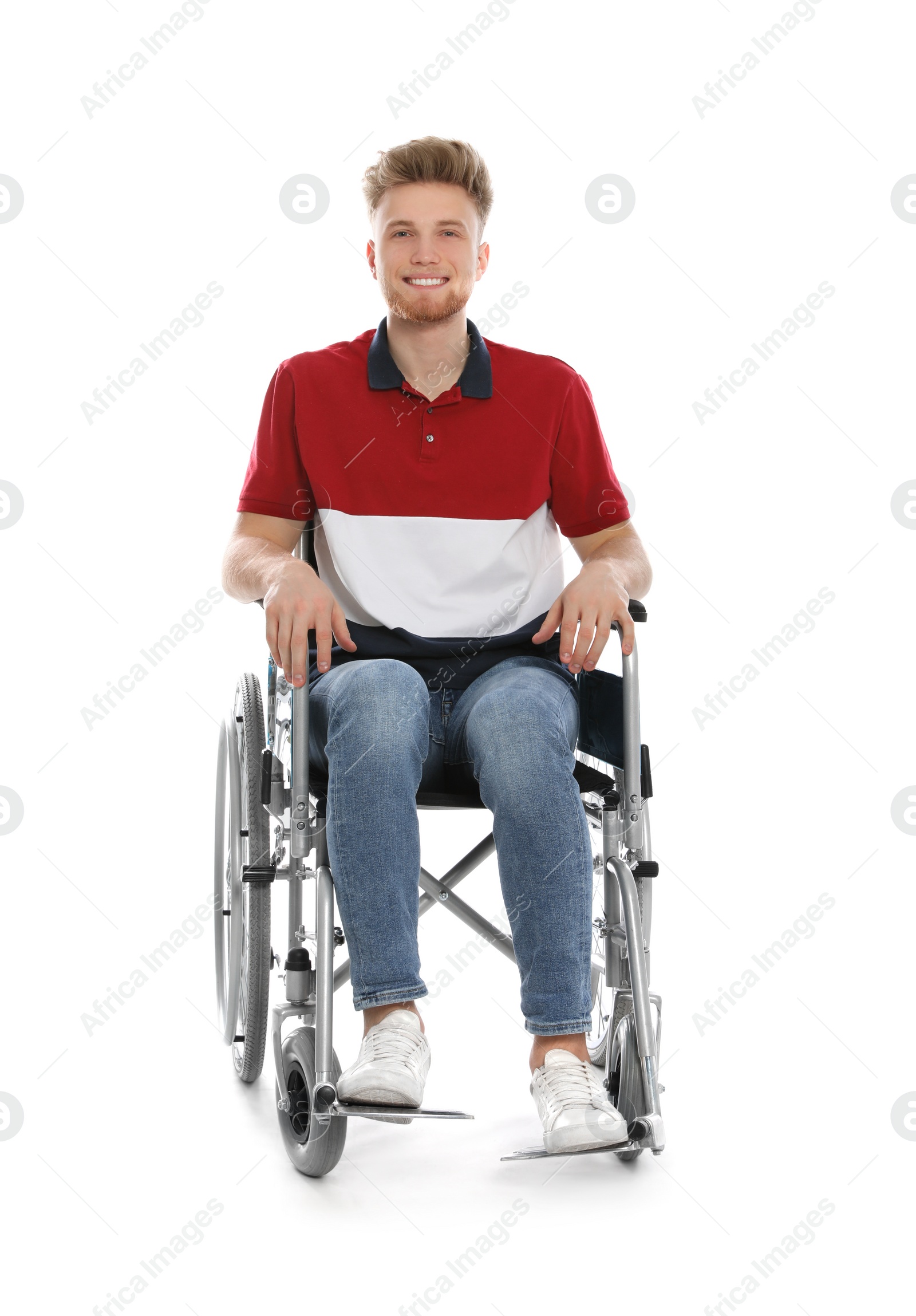 Photo of Handsome young man in wheelchair isolated on white