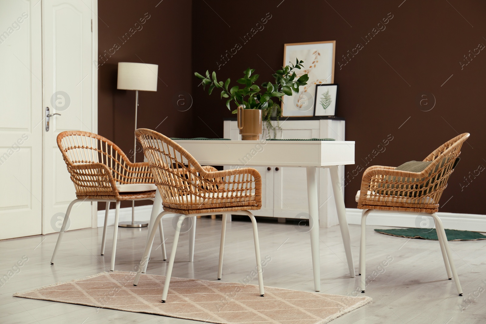 Photo of Beautiful dining room interior with new stylish furniture
