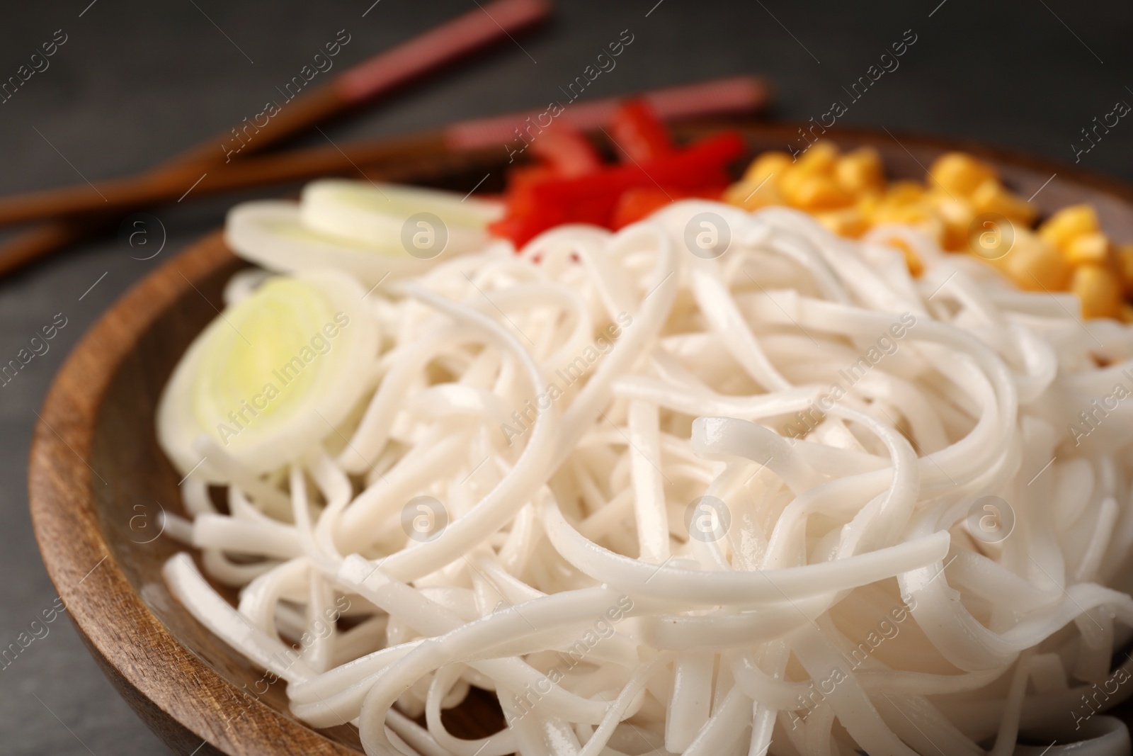 Photo of Plate with rice noodles and vegetables, closeup