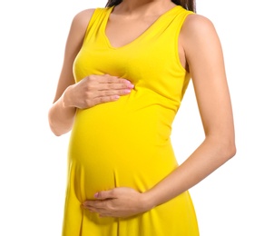 Photo of Young pregnant woman in casual clothes on white background