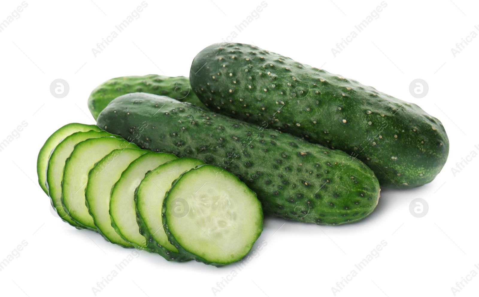 Photo of Whole and cut cucumbers on white background