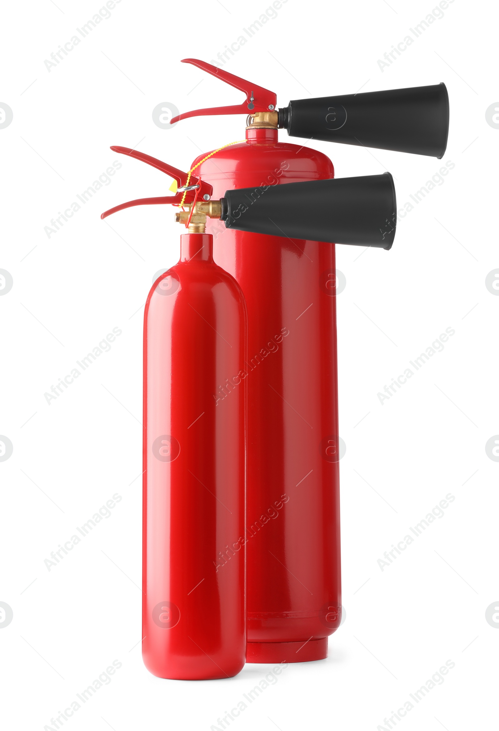 Photo of Two red fire extinguishers on white background