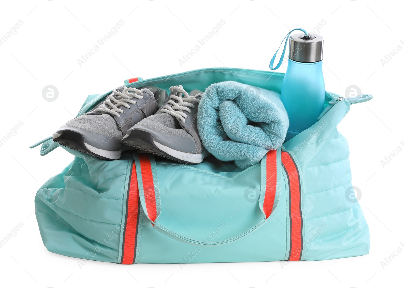 Photo of Sports bag with gym equipment on white background