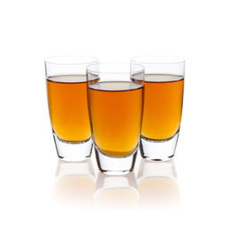 Photo of Three shots with drink isolated on white