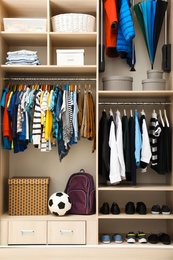 Photo of Large wardrobe with teenager clothes, shoes and accessories