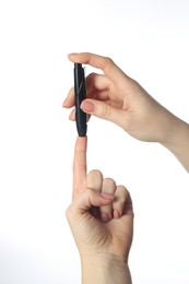 Photo of Diabetes. glucose testing. Woman using lancet pen on white background, closeup